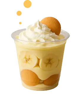 Cup of banana pudding topped with whipped cream